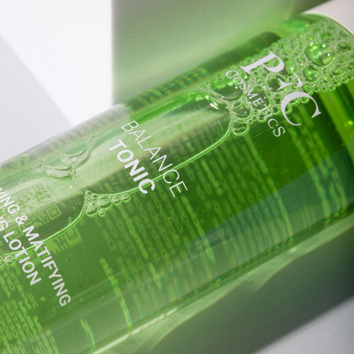 Green bottle labeled 'Balance Tonic' with visible branding on a light background